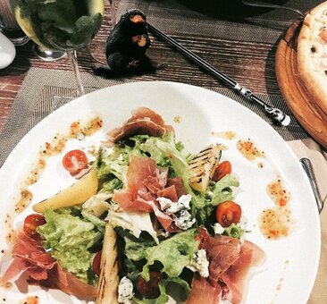 Salads at the parmesan restaurant in mariupol. book with a discount